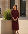 Long women's dress with batwing sleeves and a fitted waist, flowing silhouette