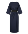 Long women's dress with batwing sleeves and a fitted waist, flowing silhouette